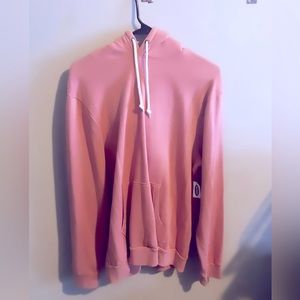 salmon or baby pink sweater